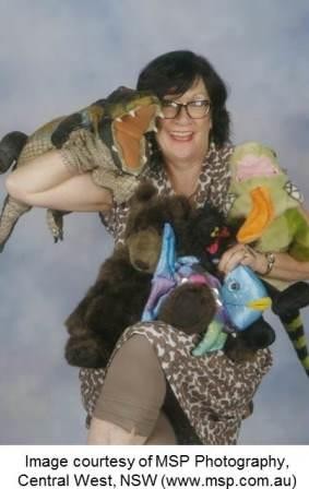 Libary teacher with Croccie the mascot and other hand puppets.